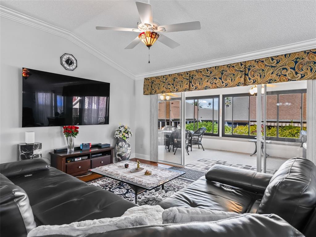 1085 Ridgeland Path The Villages, FL 32162 - Photo 11 of 56 a living room with furniture and a flat screen tv