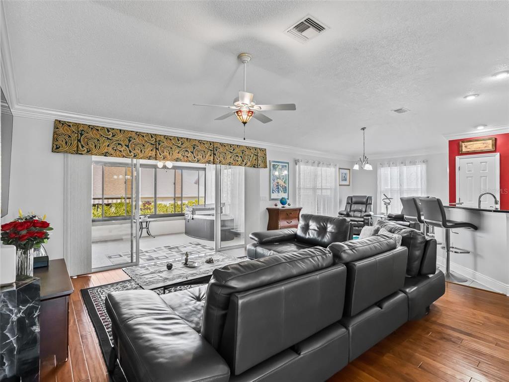 1085 Ridgeland Path The Villages, FL 32162 - Photo 12 of 56 a view of a dining room with furniture window and wooden floor