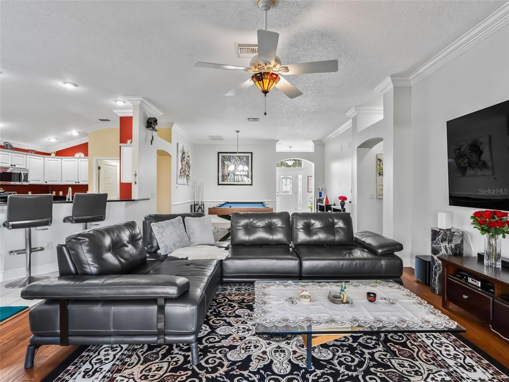 1085 Ridgeland Path The Villages, FL 32162 - Photo 14 of 56 a living room with furniture and a flat screen tv