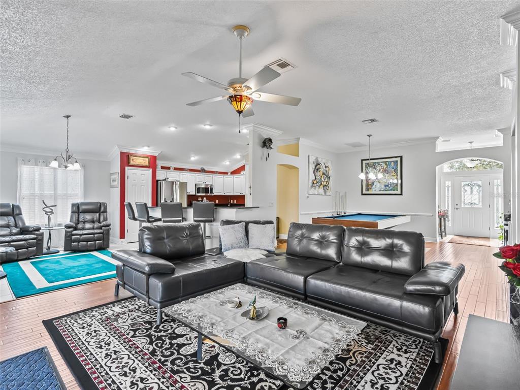 1085 Ridgeland Path The Villages, FL 32162 - Photo 16 of 56 a living room with furniture and a rug