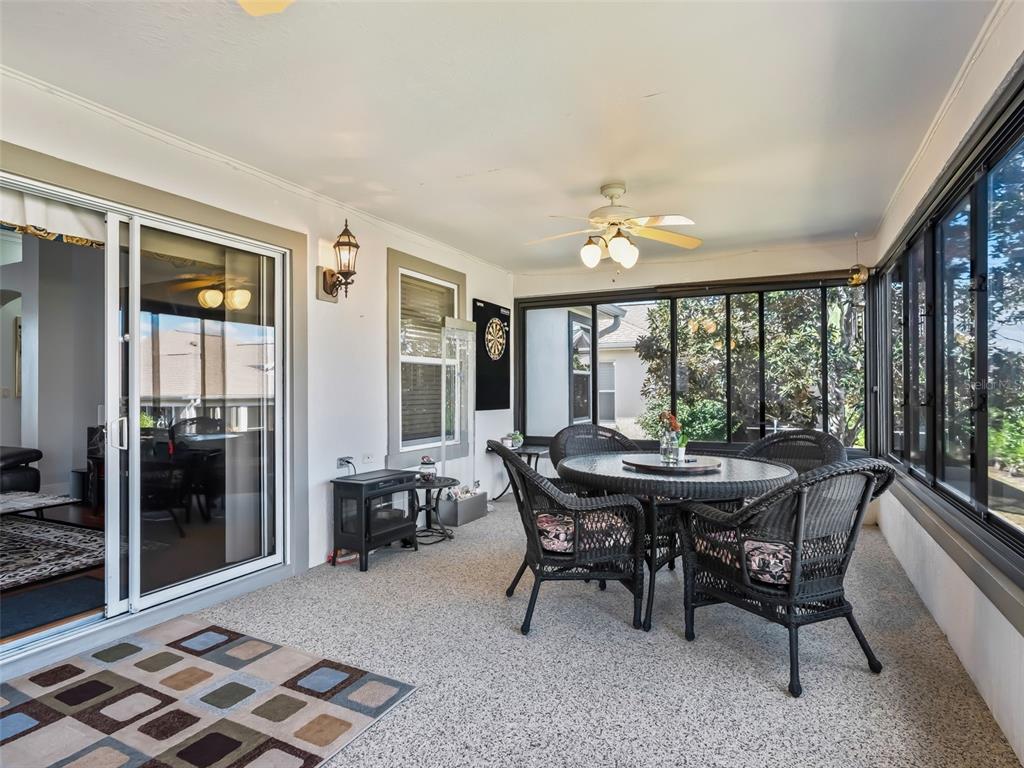 1085 Ridgeland Path The Villages, FL 32162 - Photo 25 of 56 a view of a dining room with furniture window and wooden floor