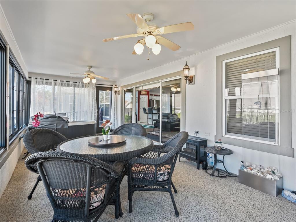 1085 Ridgeland Path The Villages, FL 32162 - Photo 26 of 56 a dining room with furniture a rug and a chandelier