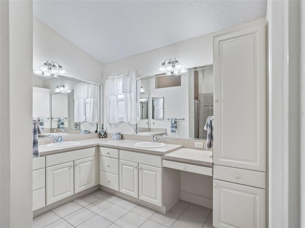 1085 Ridgeland Path The Villages, FL 32162 - Photo 30 of 56 a kitchen with a sink and cabinets