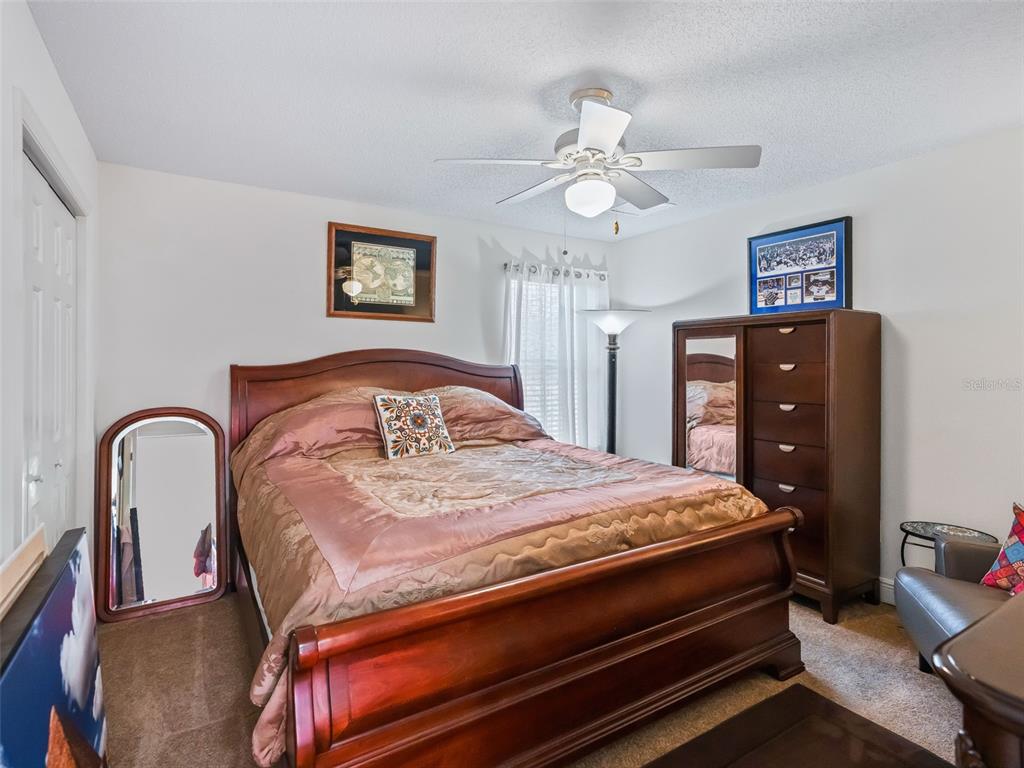 1085 Ridgeland Path The Villages, FL 32162 - Photo 36 of 56 a bedroom with a bed and dresser