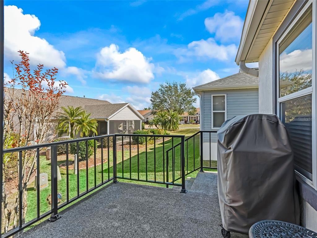1085 Ridgeland Path The Villages, FL 32162 - Photo 41 of 56 a view of a house with a backyard and a patio