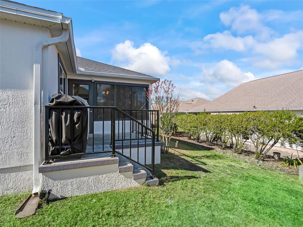 1085 Ridgeland Path The Villages, FL 32162 - Photo 43 of 56 a view of a porch with a yard