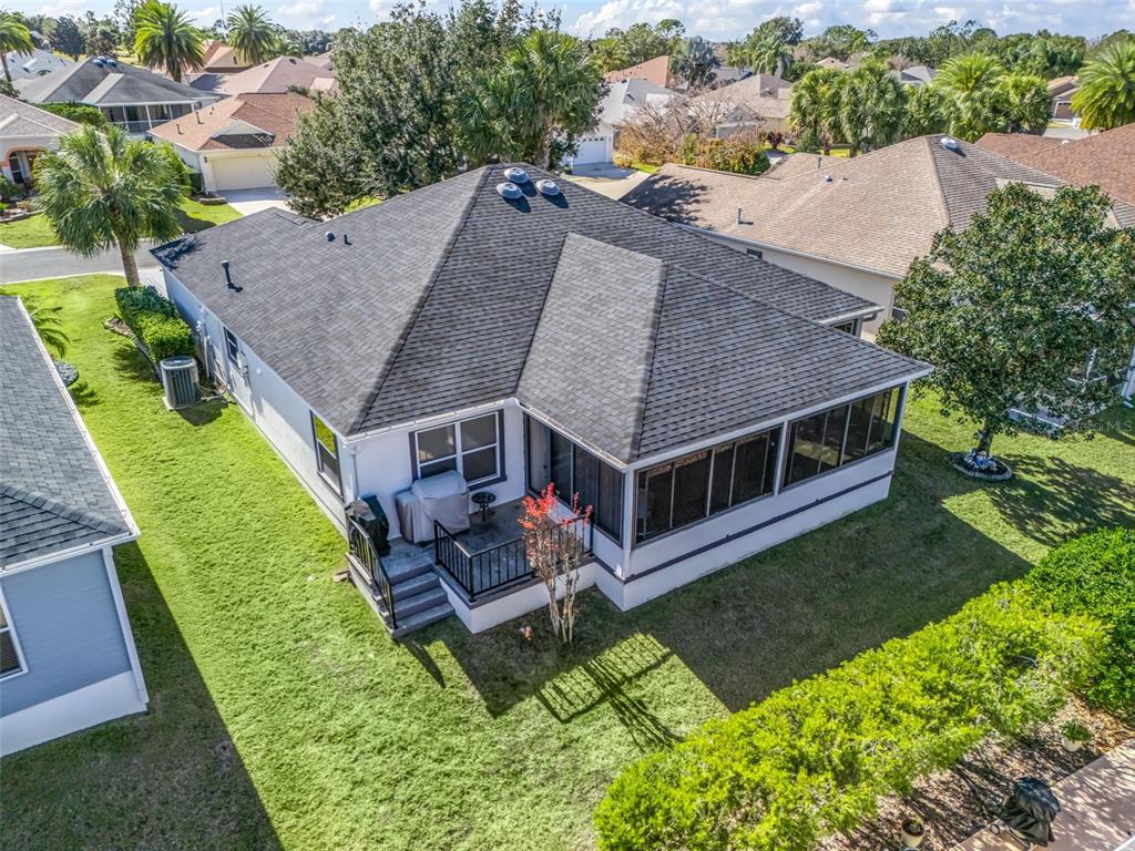 1085 Ridgeland Path The Villages, FL 32162 - Photo 48 of 56 an aerial view of a house with a yard table and chairs