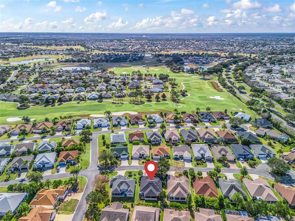 1085 Ridgeland Path The Villages, FL 32162 - Photo 49 of 56 an aerial view of residential building and lake