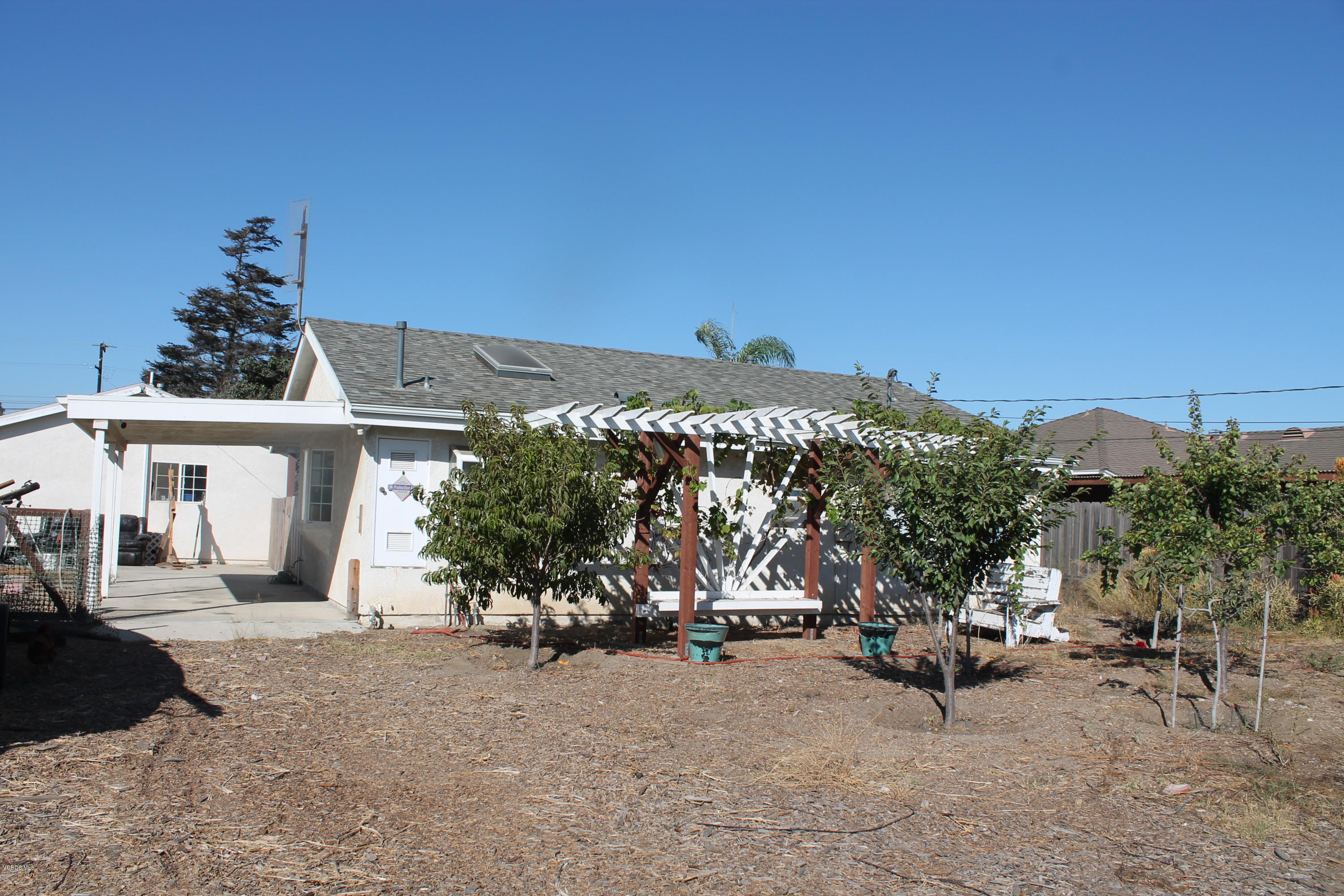 838 East Stroube Street Oxnard, CA 93036 - Photo 11 of 13 a view of a house with a outdoor space