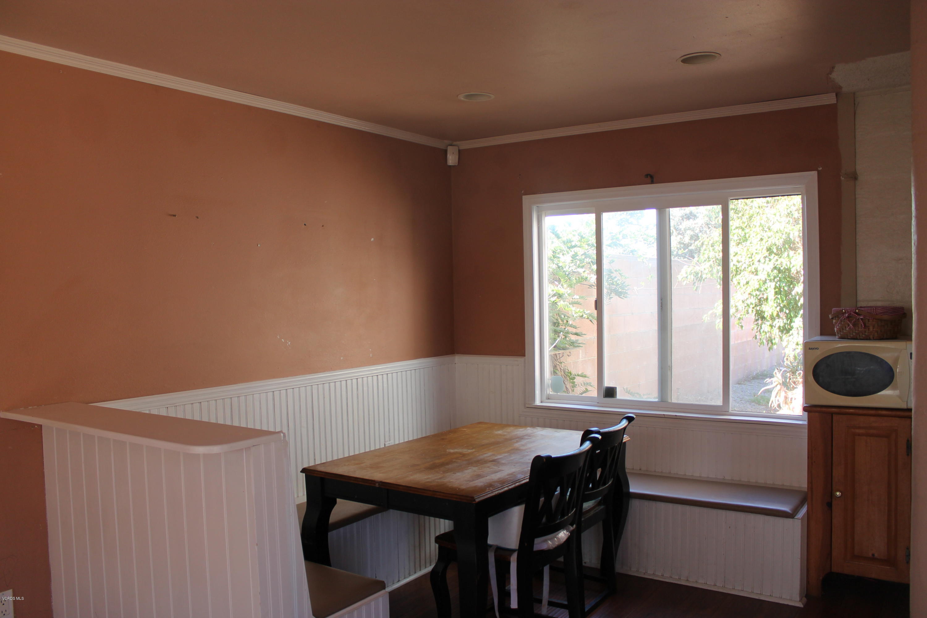 838 East Stroube Street Oxnard, CA 93036 - Photo 4 of 13 a view of a room that has a window and furniture