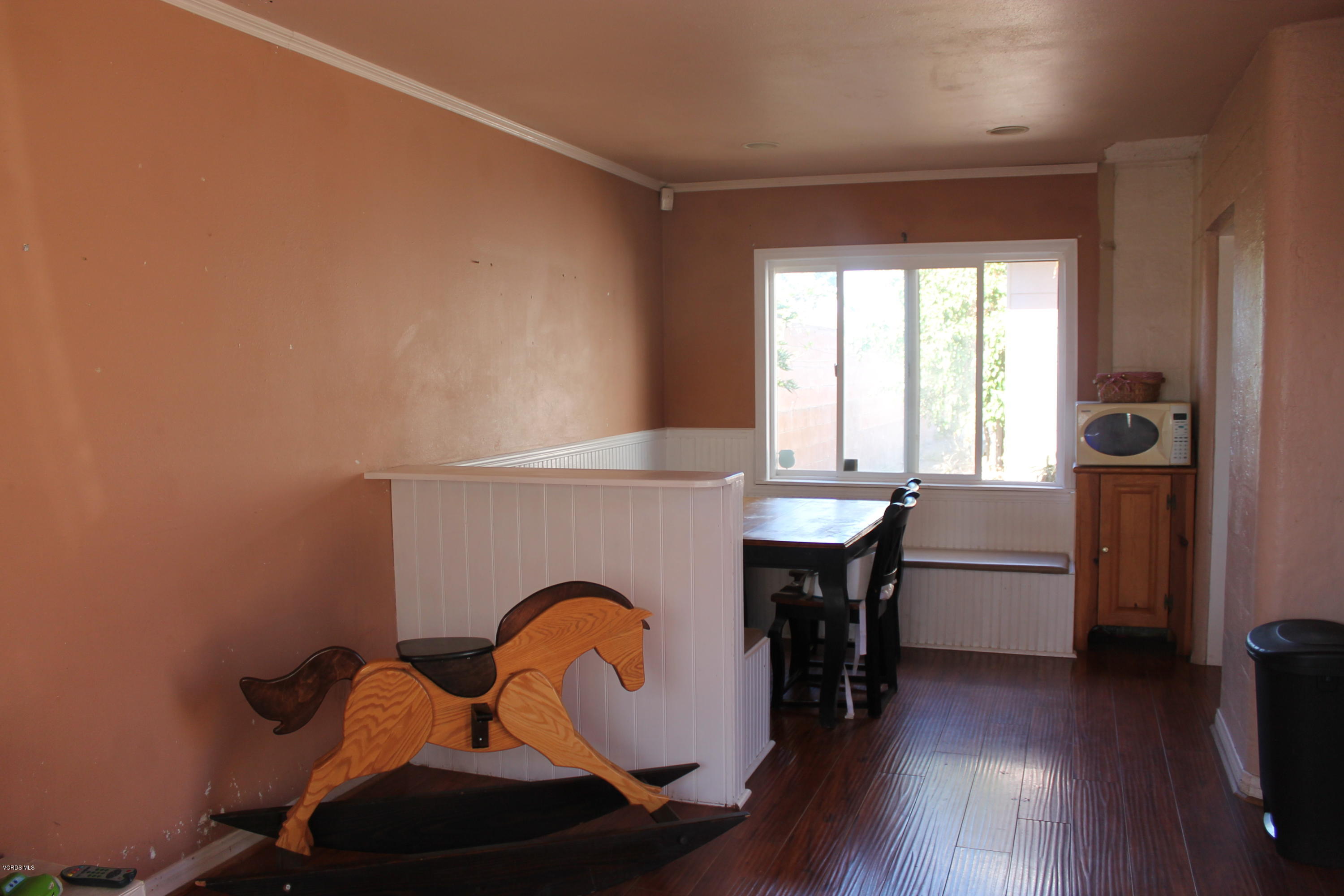 838 East Stroube Street Oxnard, CA 93036 - Photo 5 of 13 a dining room with furniture and wooden floor
