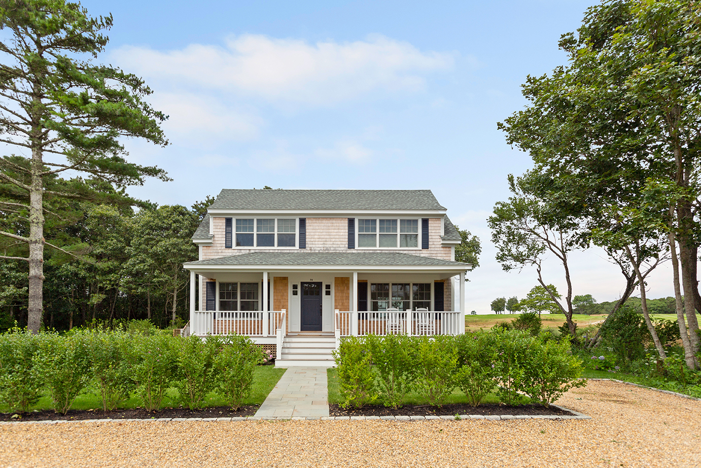 a front view of a house with a yard