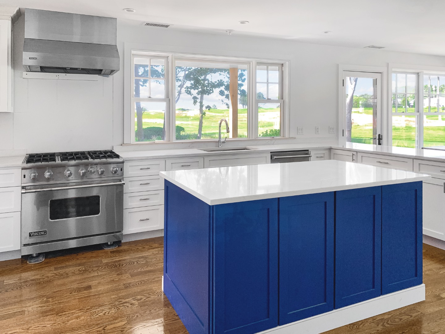 70 Curtis Lane Edgartown, MA 02539 - Photo 11 of 34 a kitchen with a sink stove and cabinets