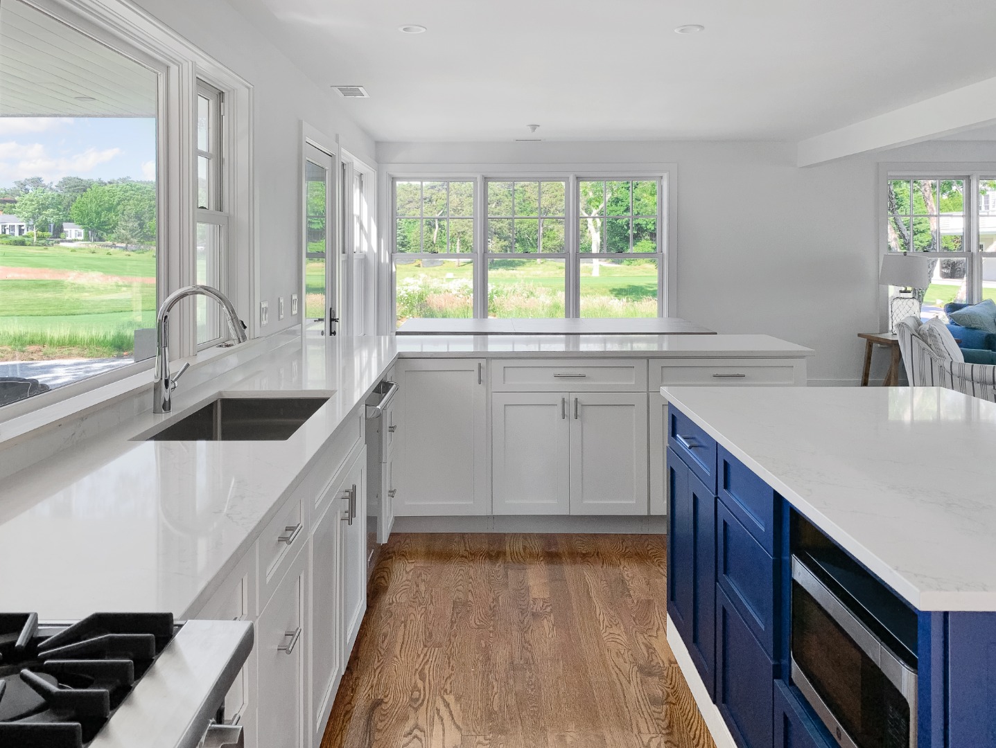 70 Curtis Lane Edgartown, MA 02539 - Photo 14 of 34 a kitchen with a sink stove and cabinets