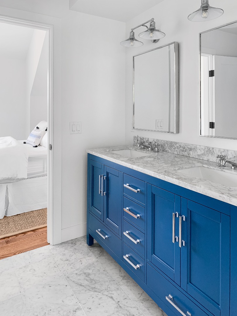 70 Curtis Lane Edgartown, MA 02539 - Photo 23 of 34 a bathroom with a granite countertop sink and a mirror