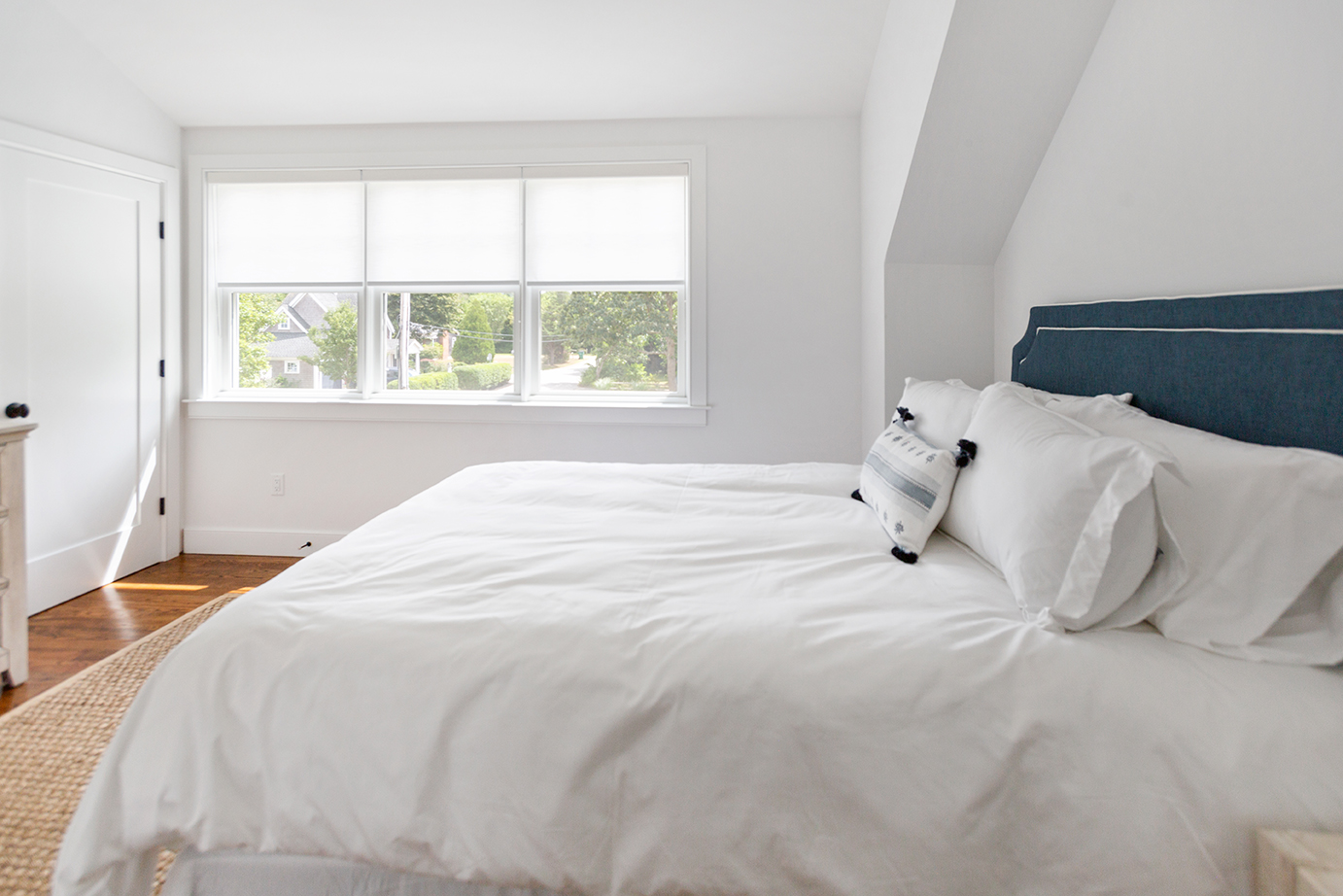 70 Curtis Lane Edgartown, MA 02539 - Photo 25 of 34 a large white bed in a room with a window