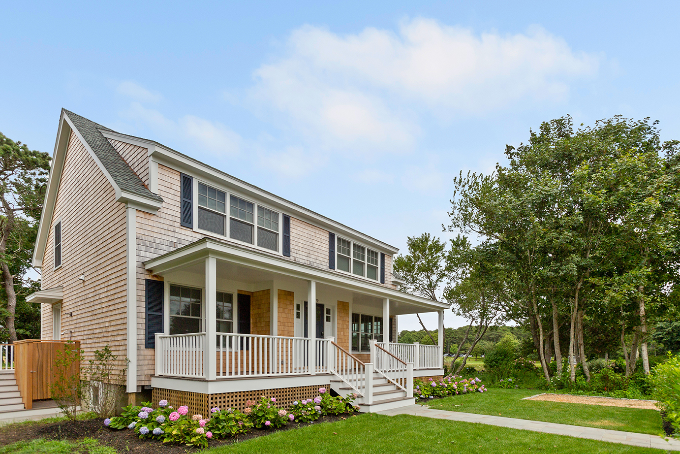 70 Curtis Lane Edgartown, MA 02539 - Photo 32 of 34 a front view of a house with a yard