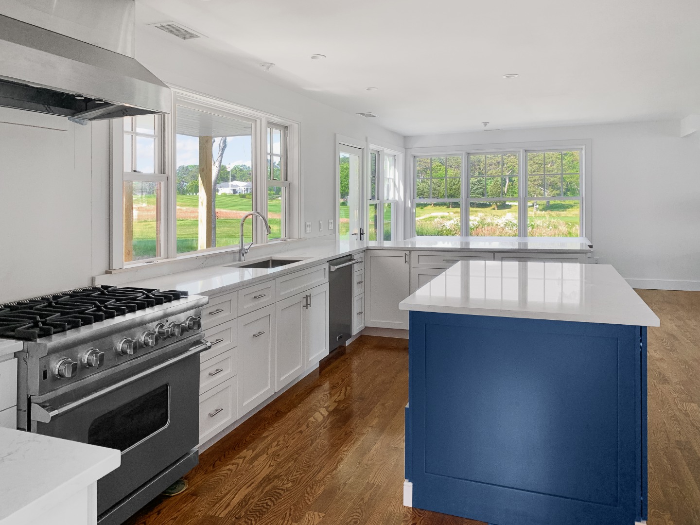 70 Curtis Lane Edgartown, MA 02539 - Photo 10 of 34 a kitchen with stainless steel appliances a sink a stove and a large window