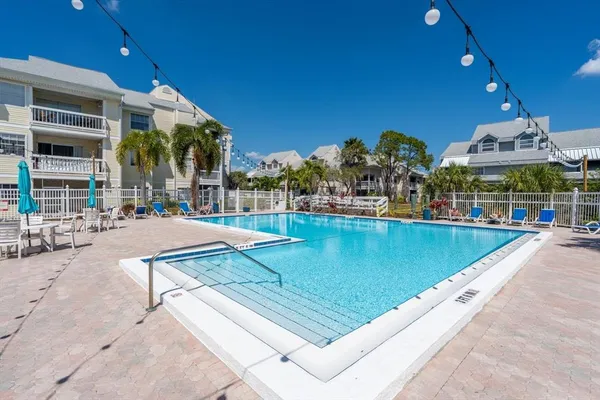 a view of a swimming pool with a patio