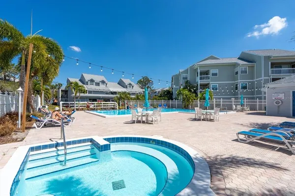 a view of a swimming pool with a patio