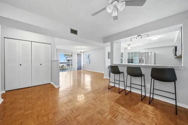 a view of a livingroom with furniture and a ceiling fan