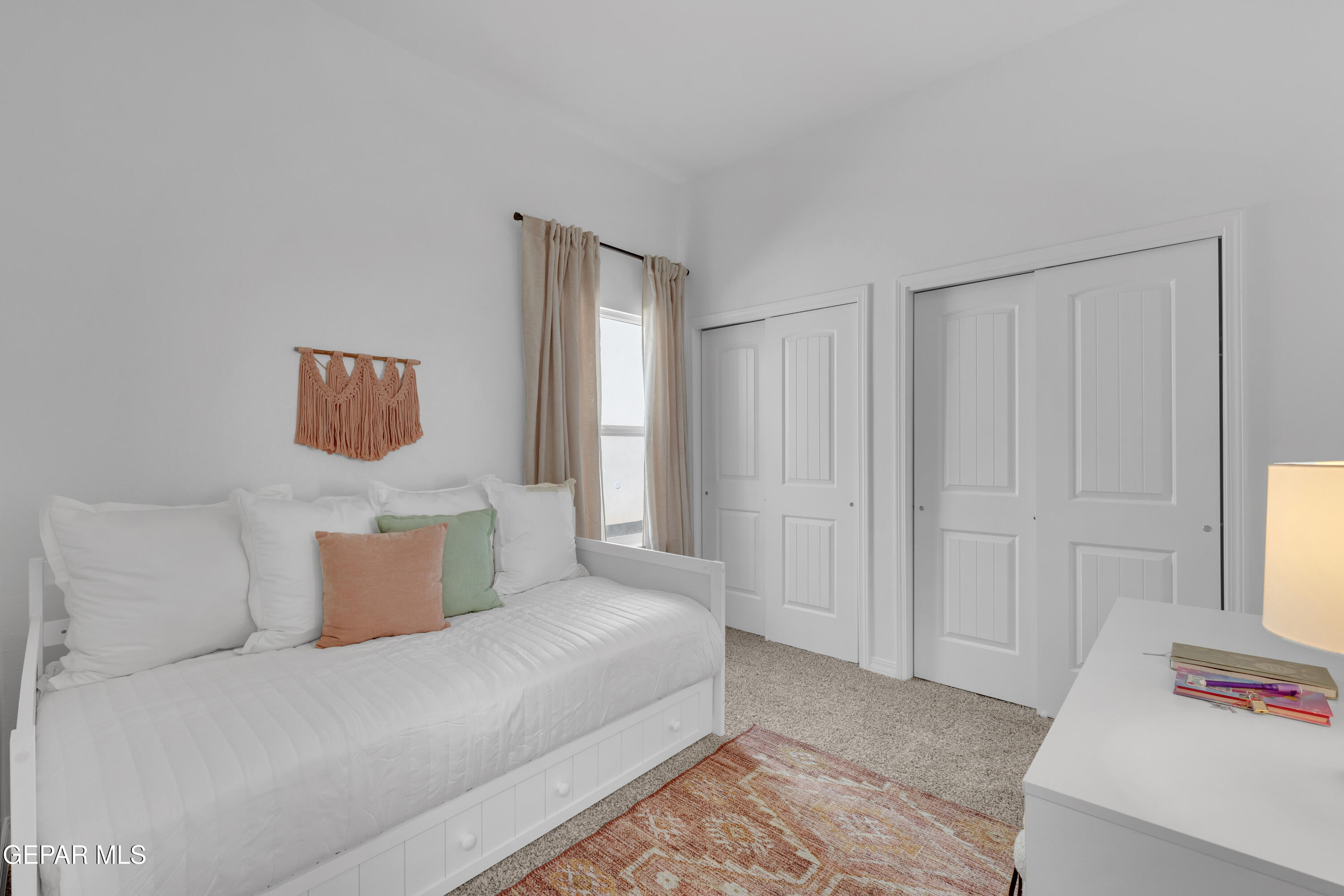 6035 Summer Ridge Santa Teresa, NM 88008 - Photo 33 of 49 a bedroom with a bed and window