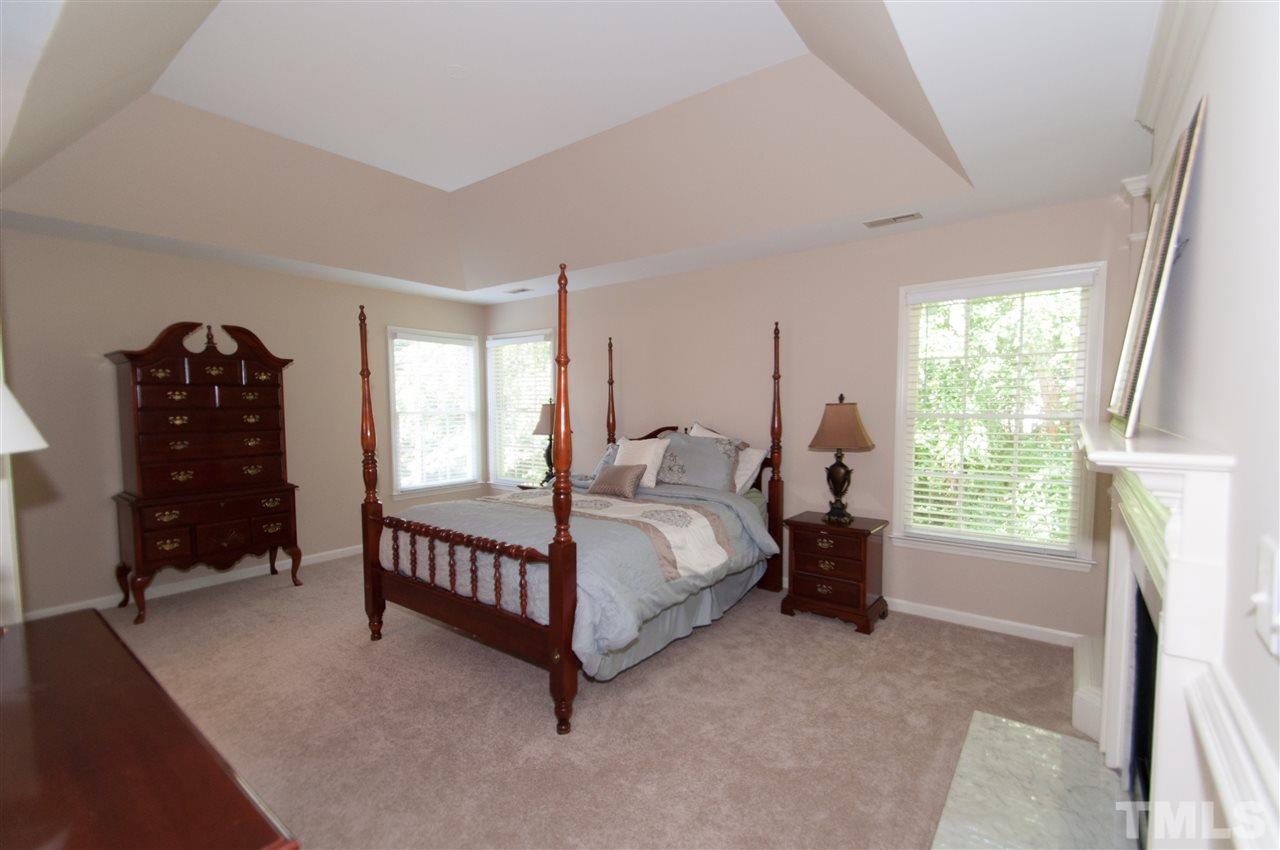 8905 Braceridge Road Raleigh, NC 27613 - Photo 11 of 25 a bed room with a bed and a window