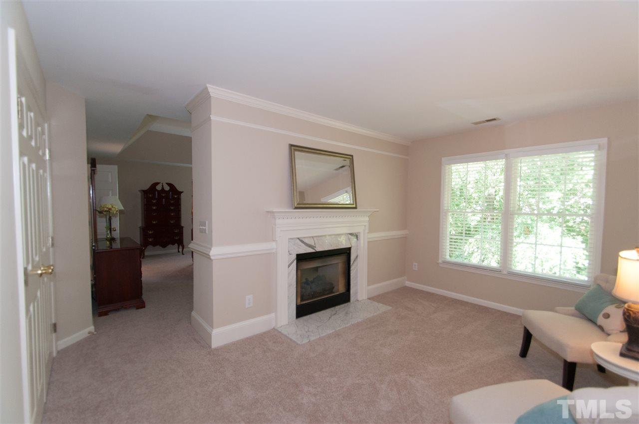 8905 Braceridge Road Raleigh, NC 27613 - Photo 13 of 25 a living room with furniture and a fireplace