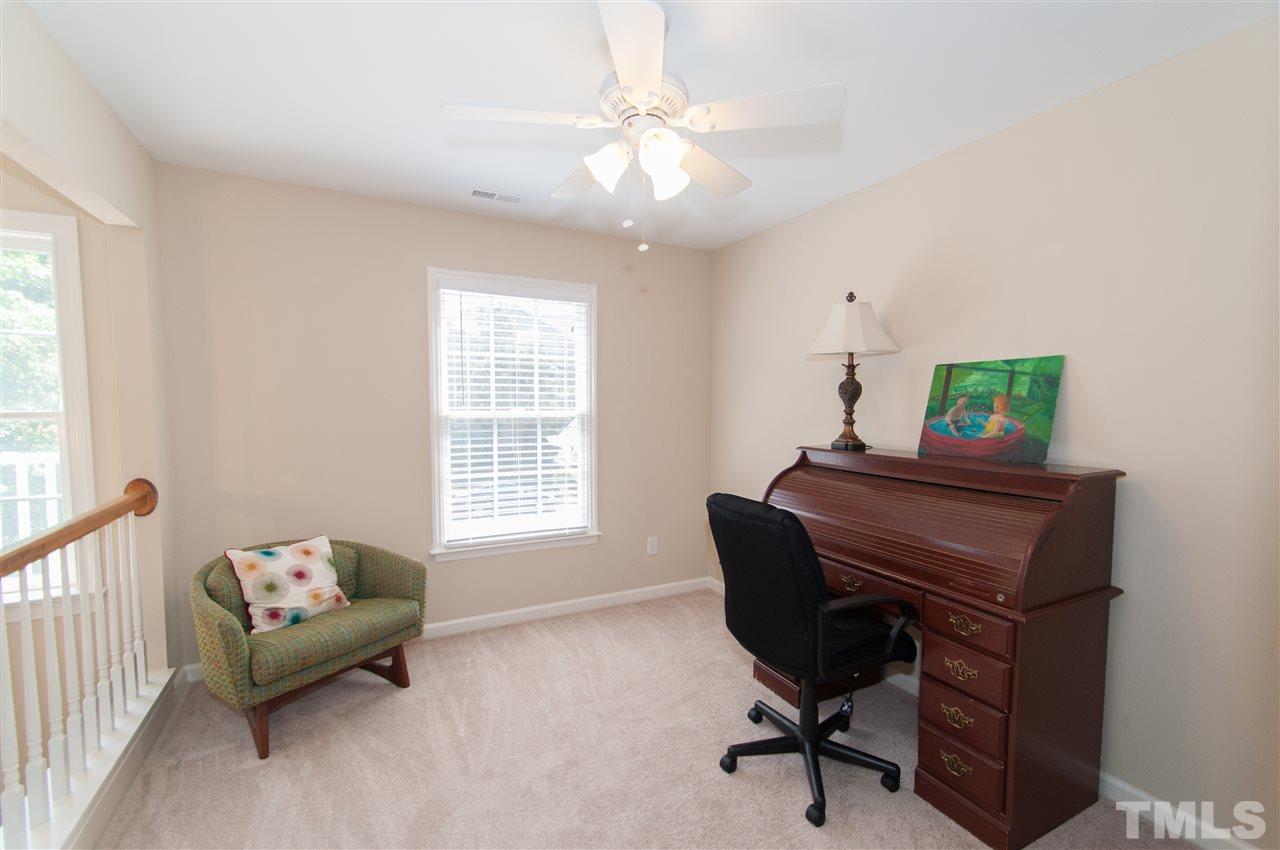 8905 Braceridge Road Raleigh, NC 27613 - Photo 17 of 25 a living room with furniture and a window
