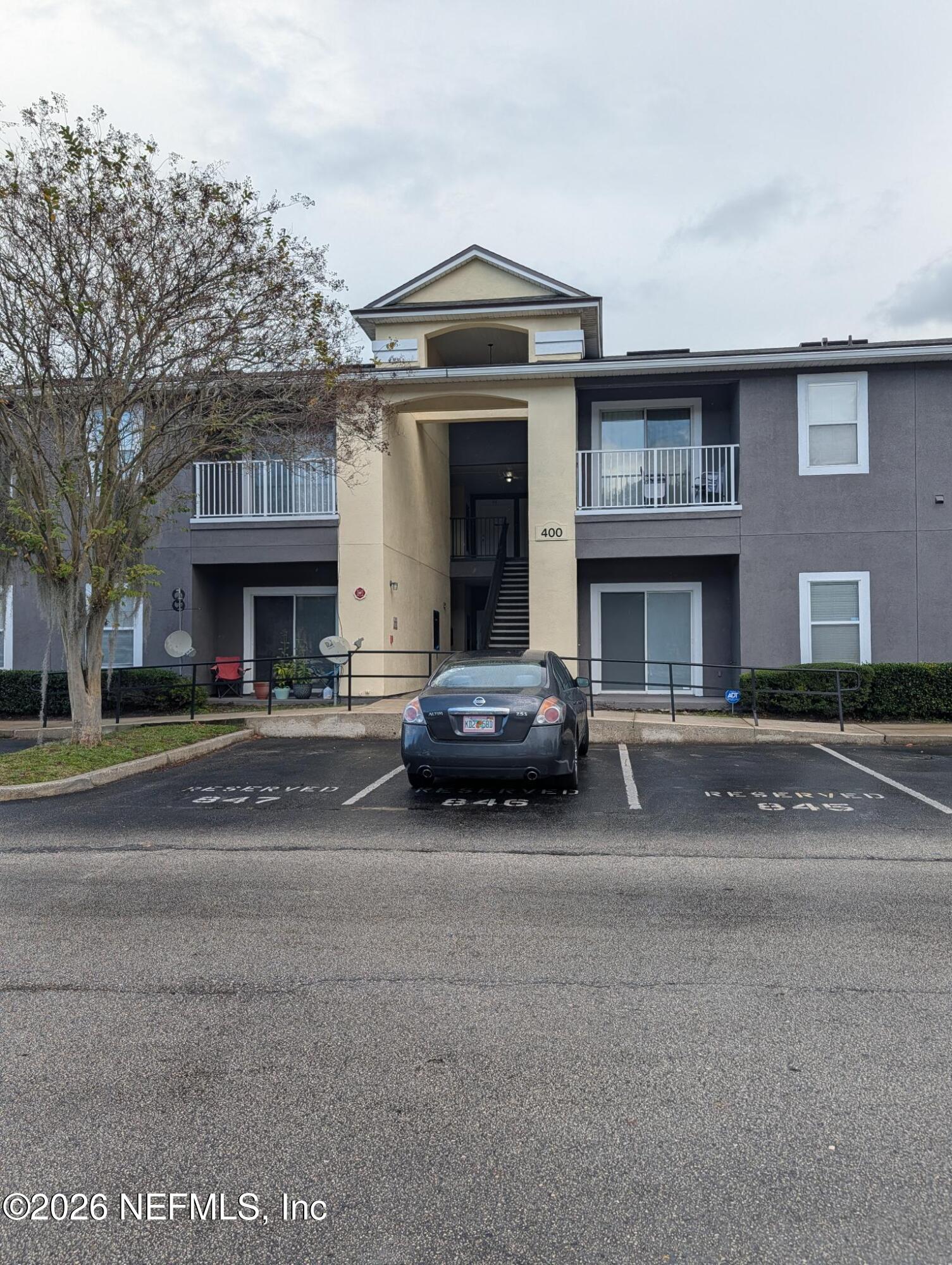 7920 Merrill Road, Unit 1412 Jacksonville, FL 32277 - Photo 12 of 12 a car parked in front of a building