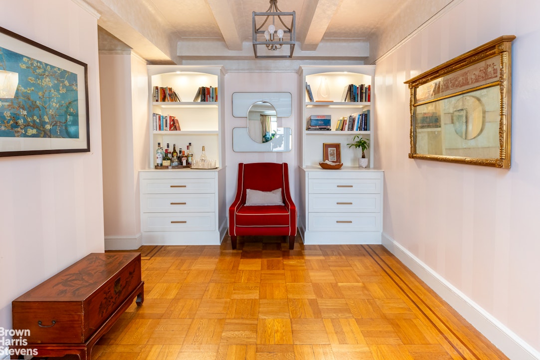 325 East 79th Street, Unit 3E Manhattan, NY 10075 - Photo 4 of 14 a bedroom with a bed and wooden floor