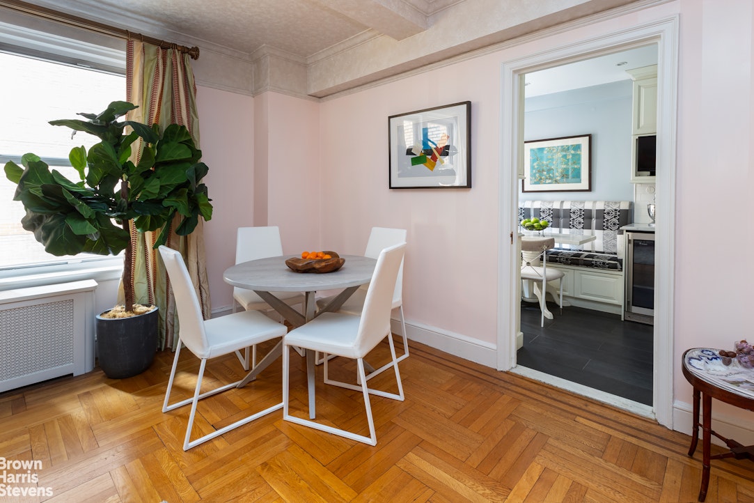 325 East 79th Street, Unit 3E Manhattan, NY 10075 - Photo 6 of 14 a dining room with furniture and window