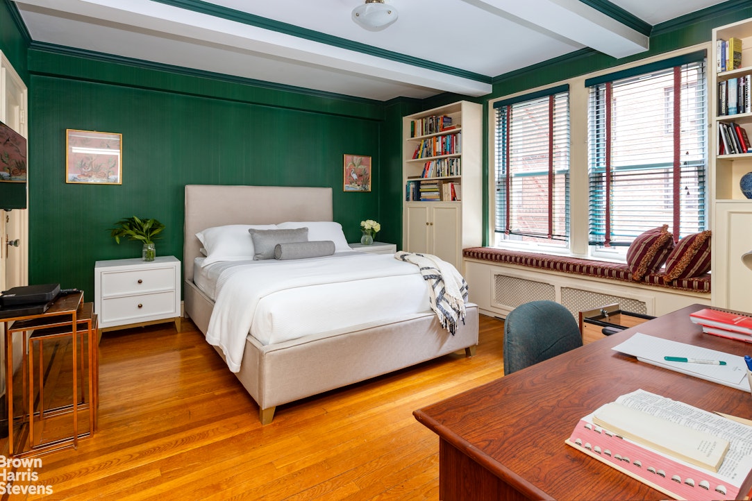 325 East 79th Street, Unit 3E Manhattan, NY 10075 - Photo 8 of 14 a bedroom with a bed and a couch