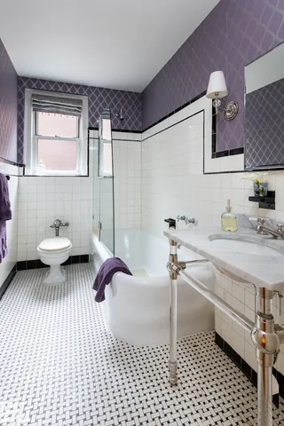 a bathroom with a sink a toilet and mirror