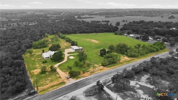 a view of a garden from a balcony