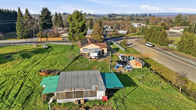 an aerial view of a house with a garden