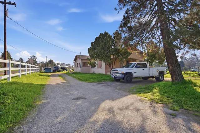 a view of a house with truck parked