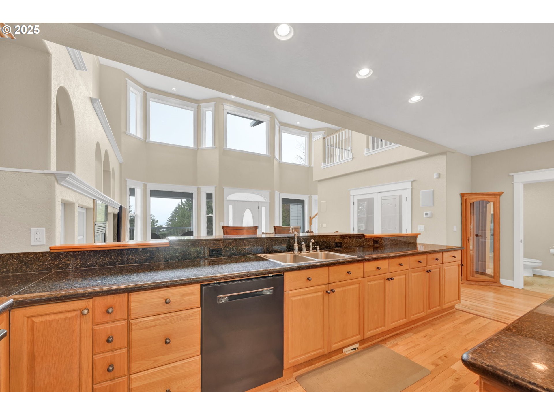 2375 Lasater Boulevard Eugene, OR 97405 - Photo 12 of 46 a large kitchen with granite countertop a sink and cabinets