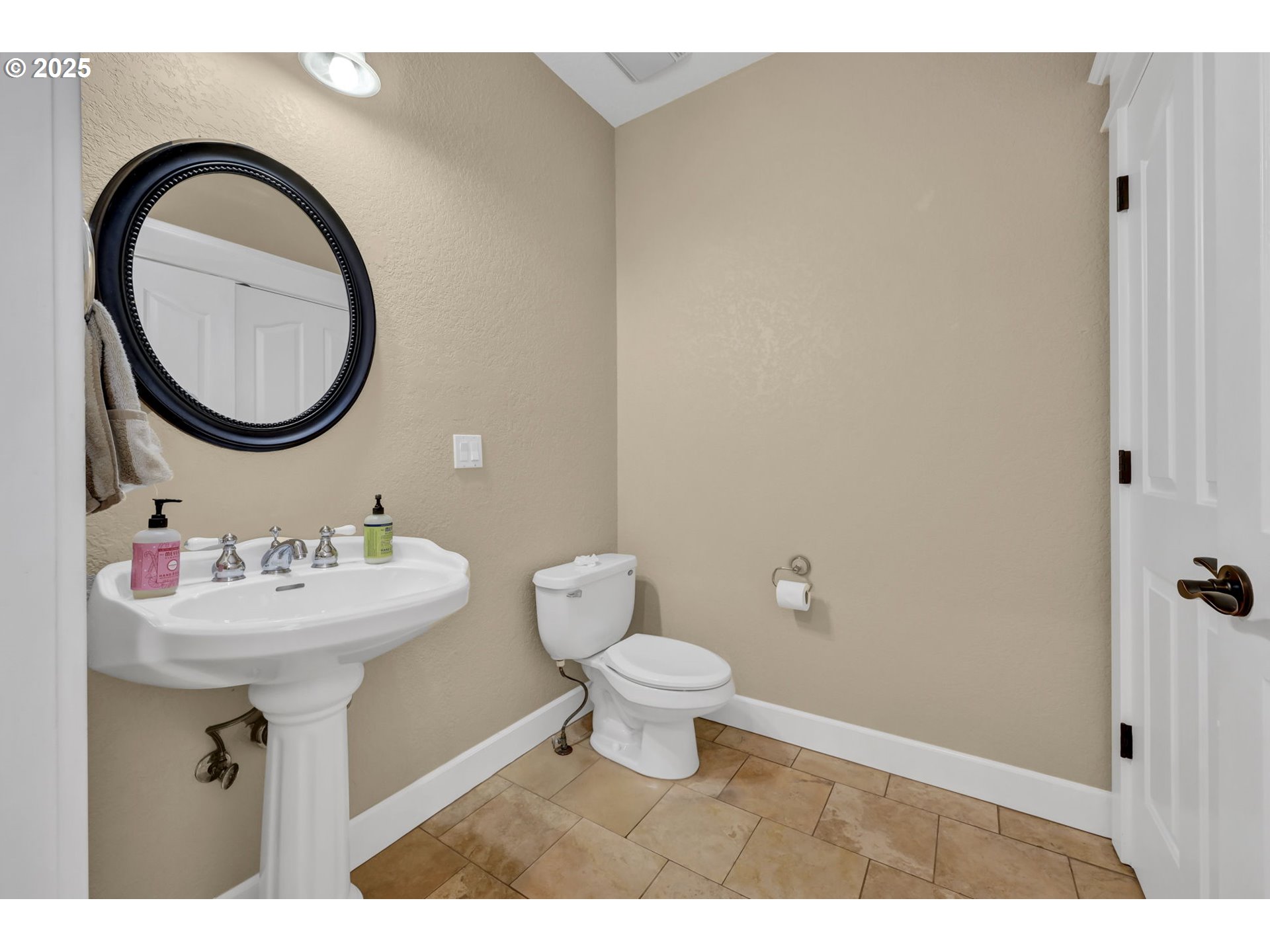 2375 Lasater Boulevard Eugene, OR 97405 - Photo 16 of 46 a bathroom with a sink a mirror and a toilet