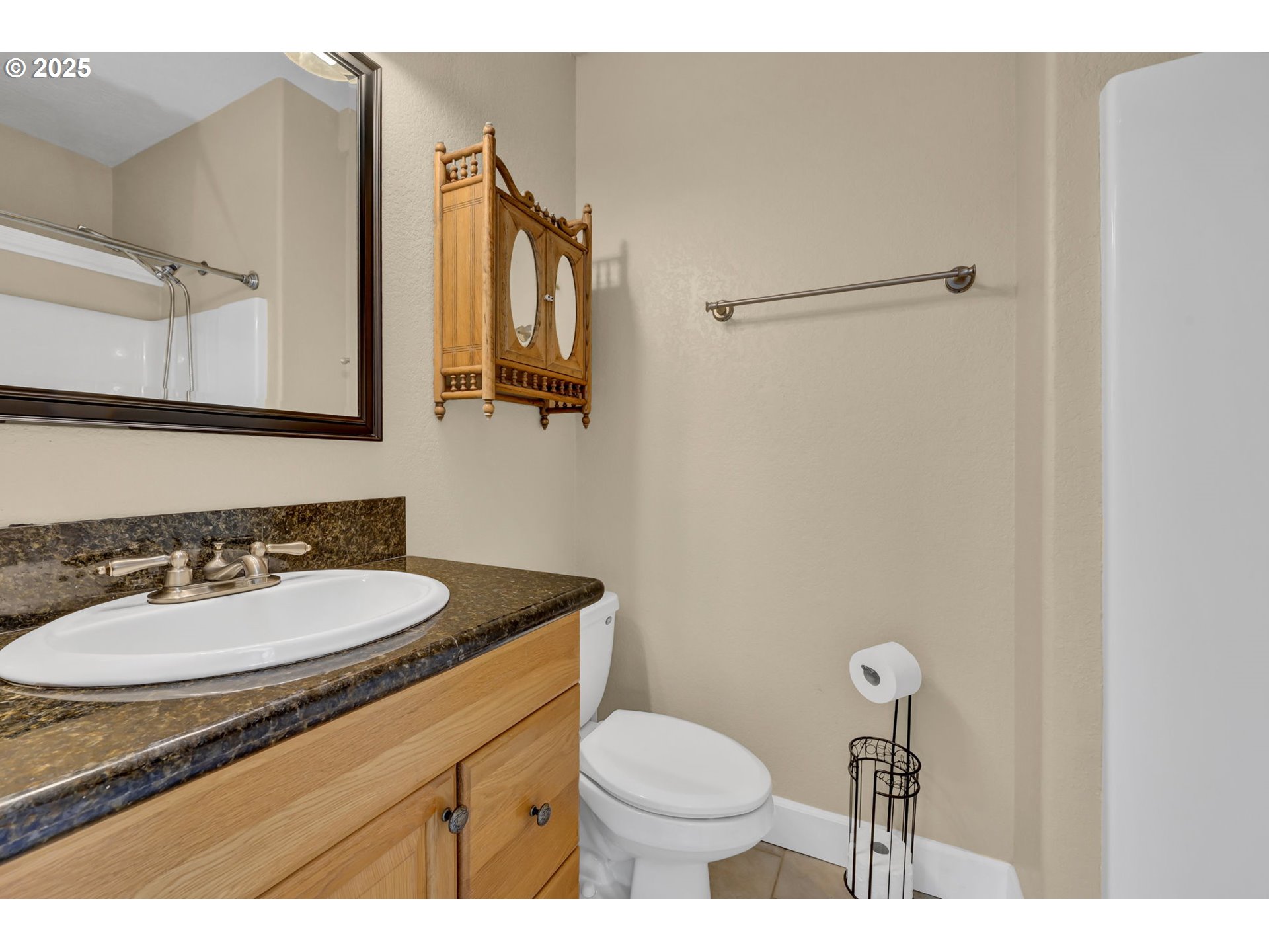 2375 Lasater Boulevard Eugene, OR 97405 - Photo 18 of 46 a bathroom with a granite countertop sink mirror vanity and toilet