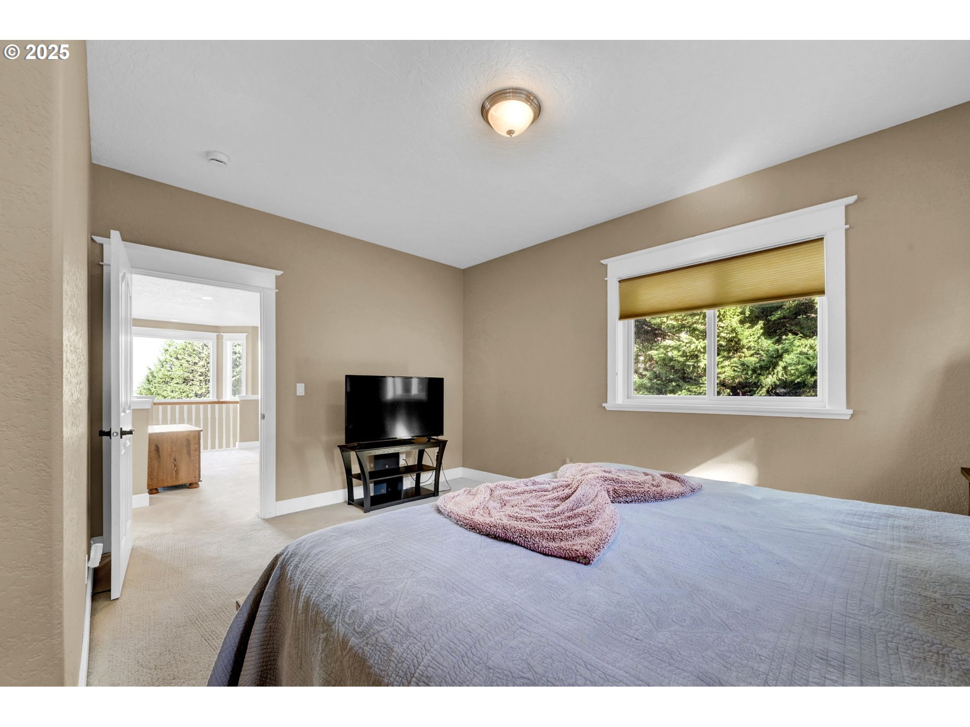 2375 Lasater Boulevard Eugene, OR 97405 - Photo 27 of 46 a bedroom with a bed and a tv on the dresser