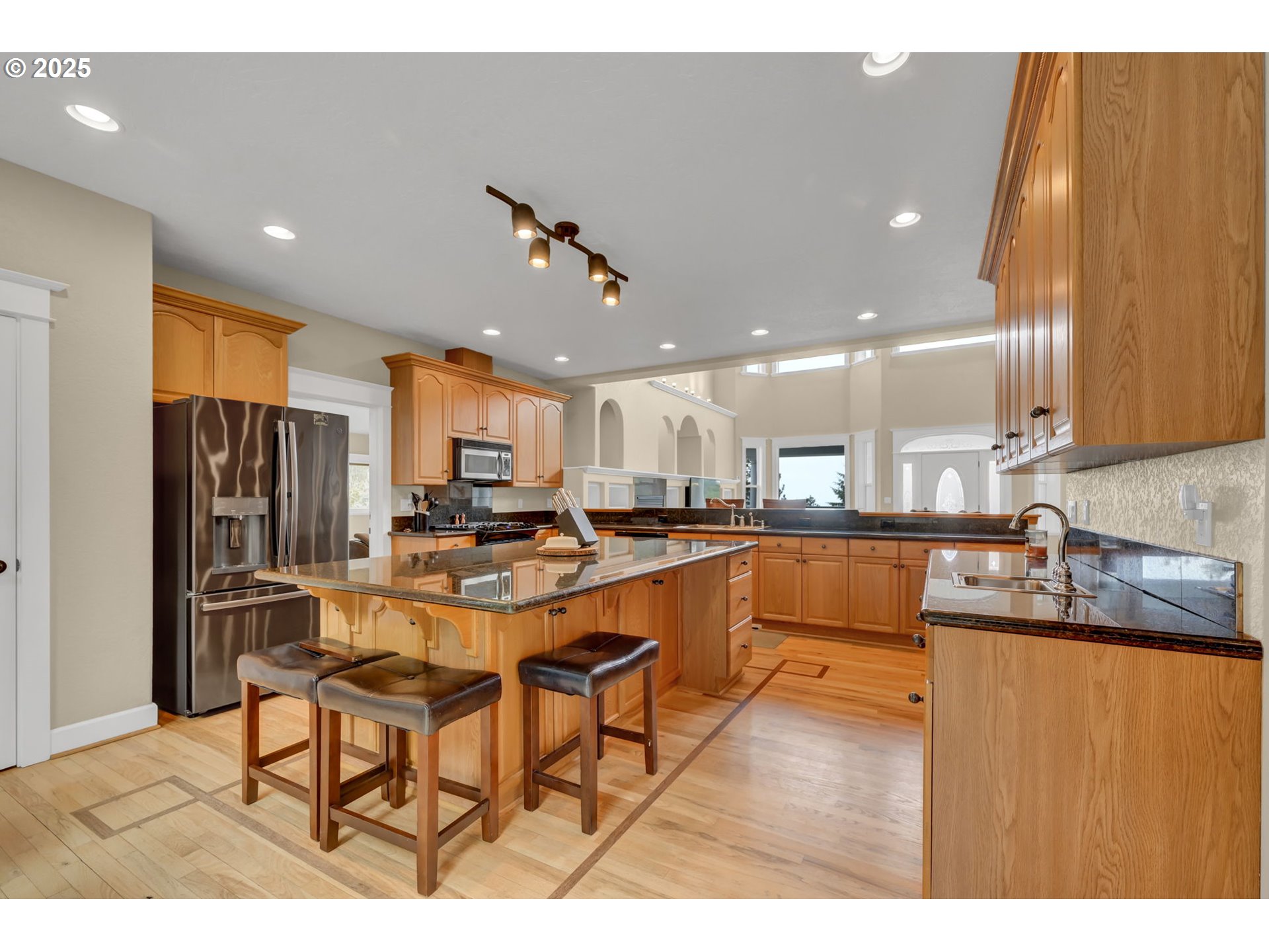 2375 Lasater Boulevard Eugene, OR 97405 - Photo 10 of 46 a living room with stainless steel appliances kitchen island granite countertop furniture and a kitchen view