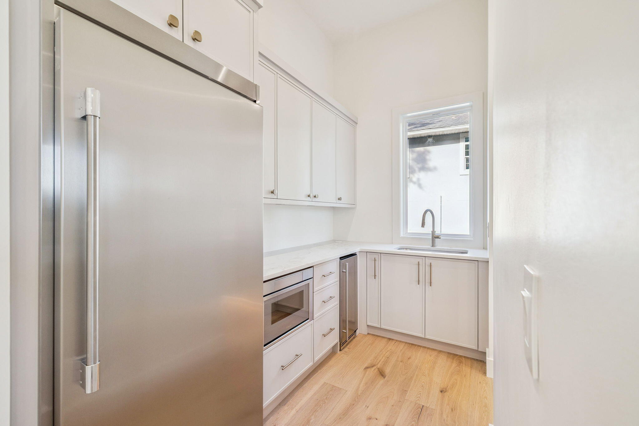 672 North Walton Lakeshore Dr Inlet Beach Inlet Beach, FL 32461 - Photo 26 of 88 a kitchen with white cabinets and white appliances