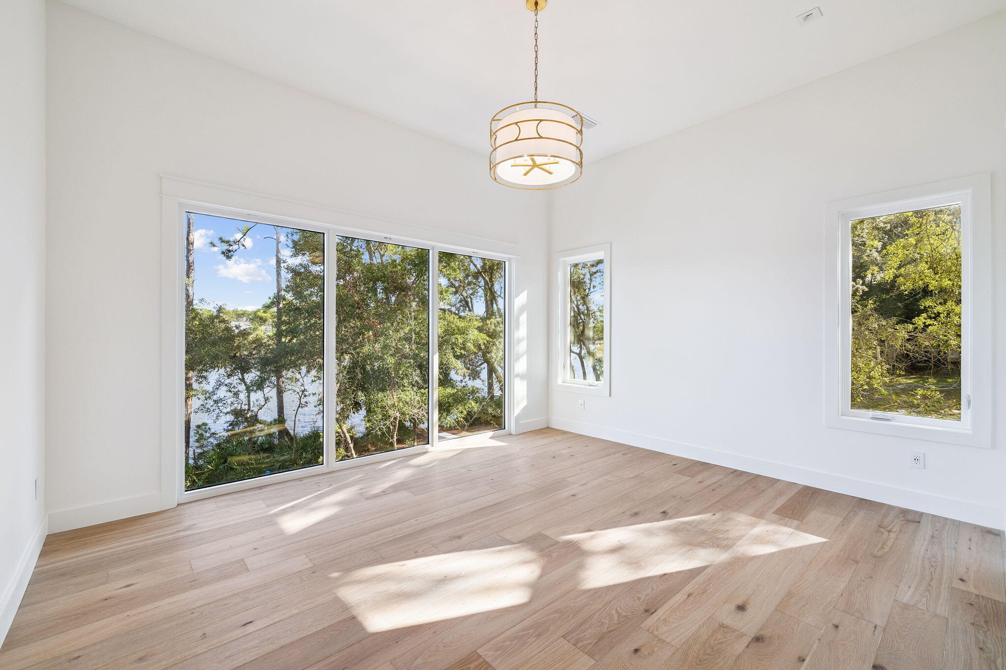 672 North Walton Lakeshore Dr Inlet Beach Inlet Beach, FL 32461 - Photo 31 of 88 a view of an empty room with wooden floor and a window