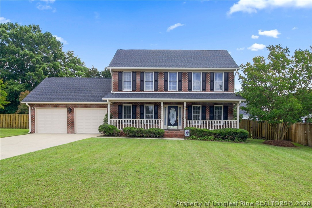 28 Coyt Circle Spring Lake, NC 28390 - Photo 2 of 41 a front view of a house with a yard and trees