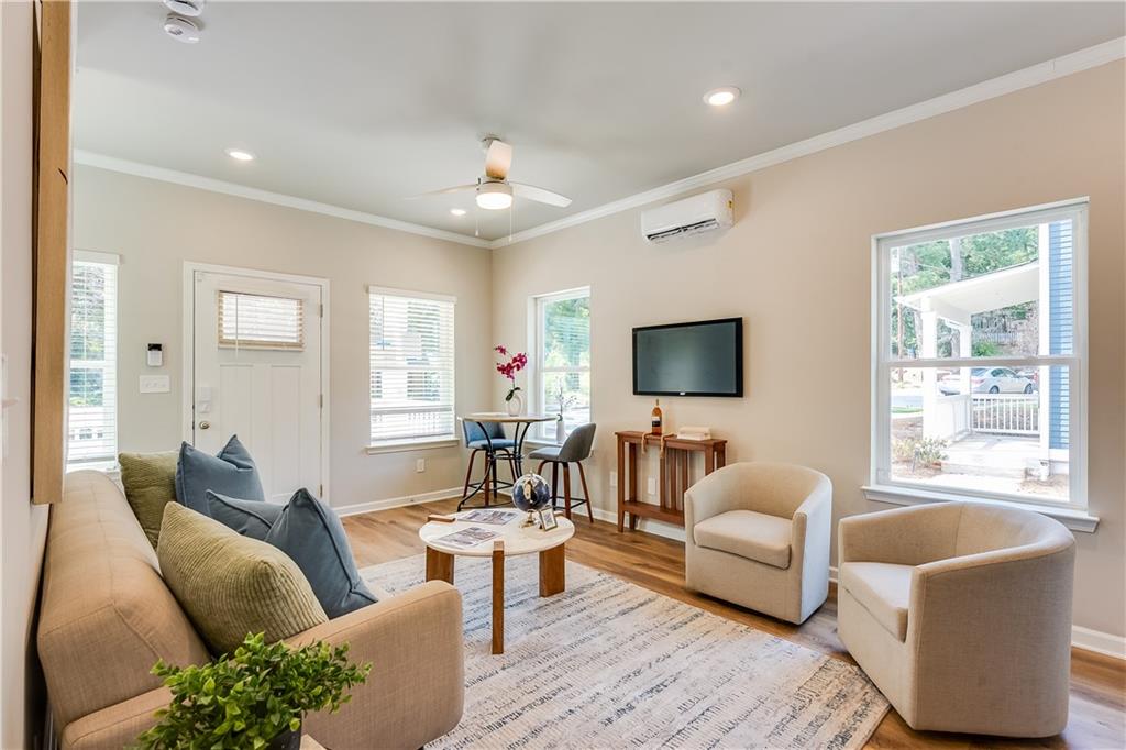 962 Lawton Street Southwest Atlanta, GA 30310 - Photo 5 of 14 a living room with furniture and a flat screen tv