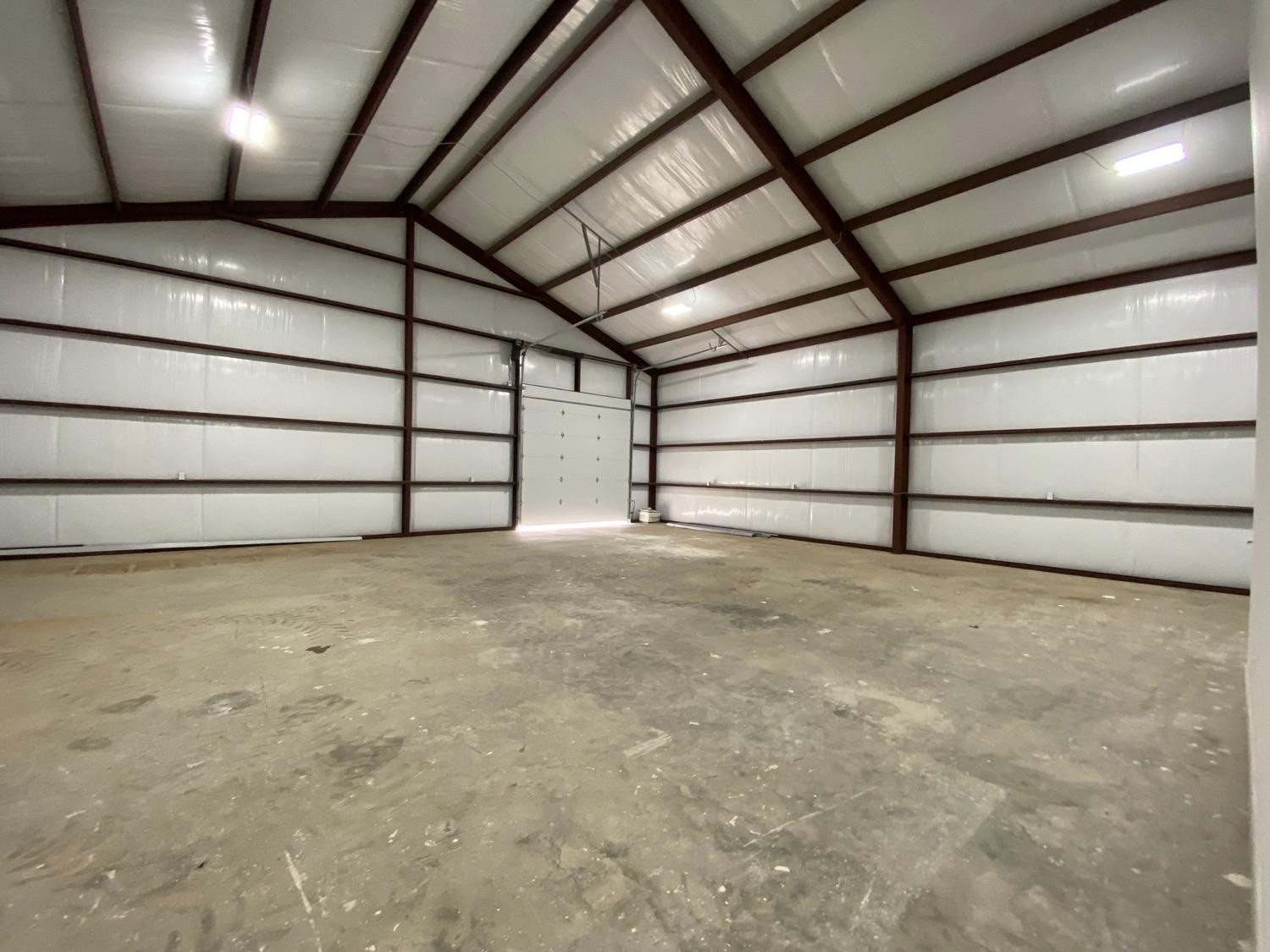21402 County Road 2140 Lubbock, TX 79423 - Photo 13 of 23 a view of an empty garage