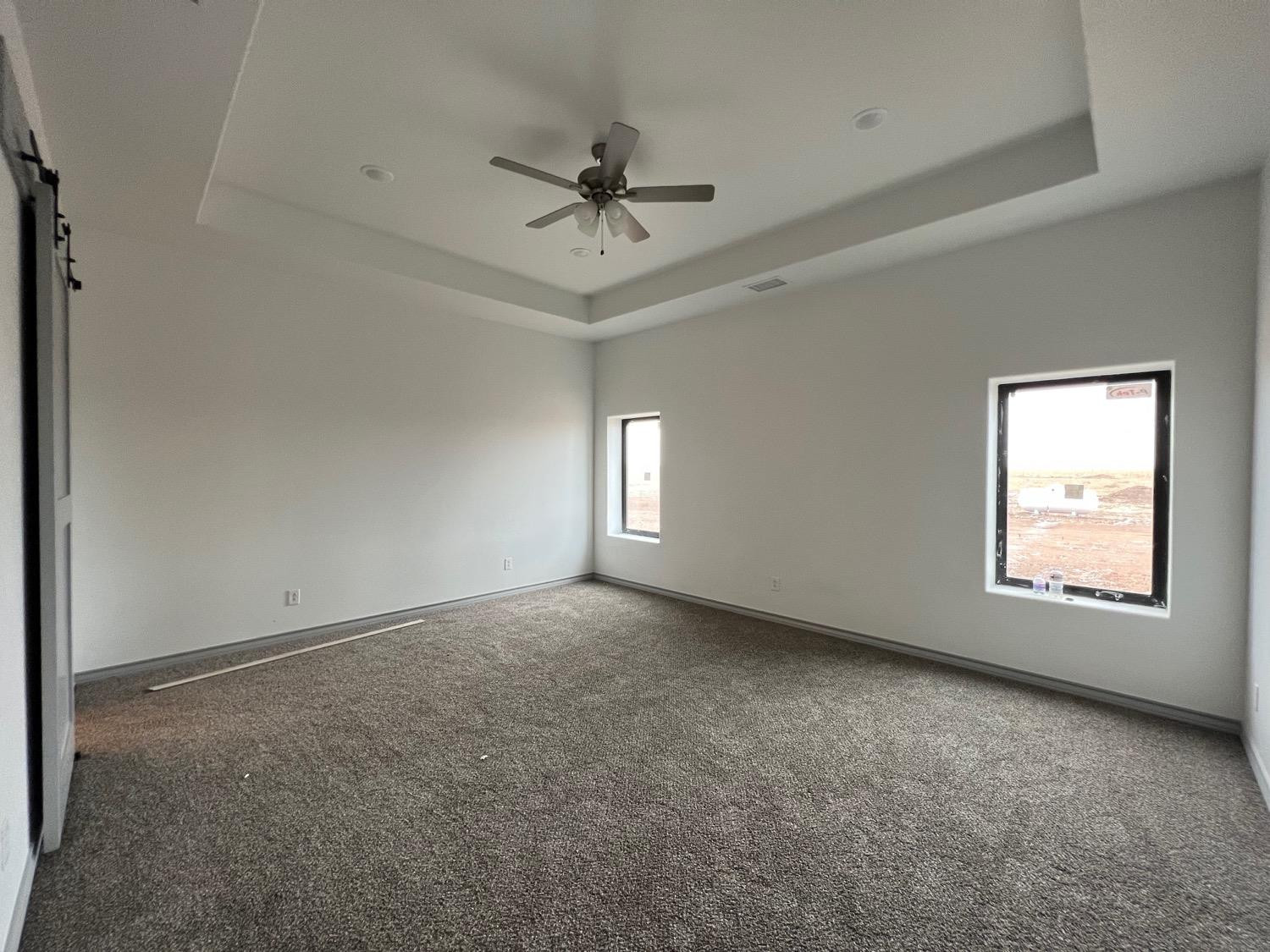 21402 County Road 2140 Lubbock, TX 79423 - Photo 18 of 23 an empty room with a window and a fan