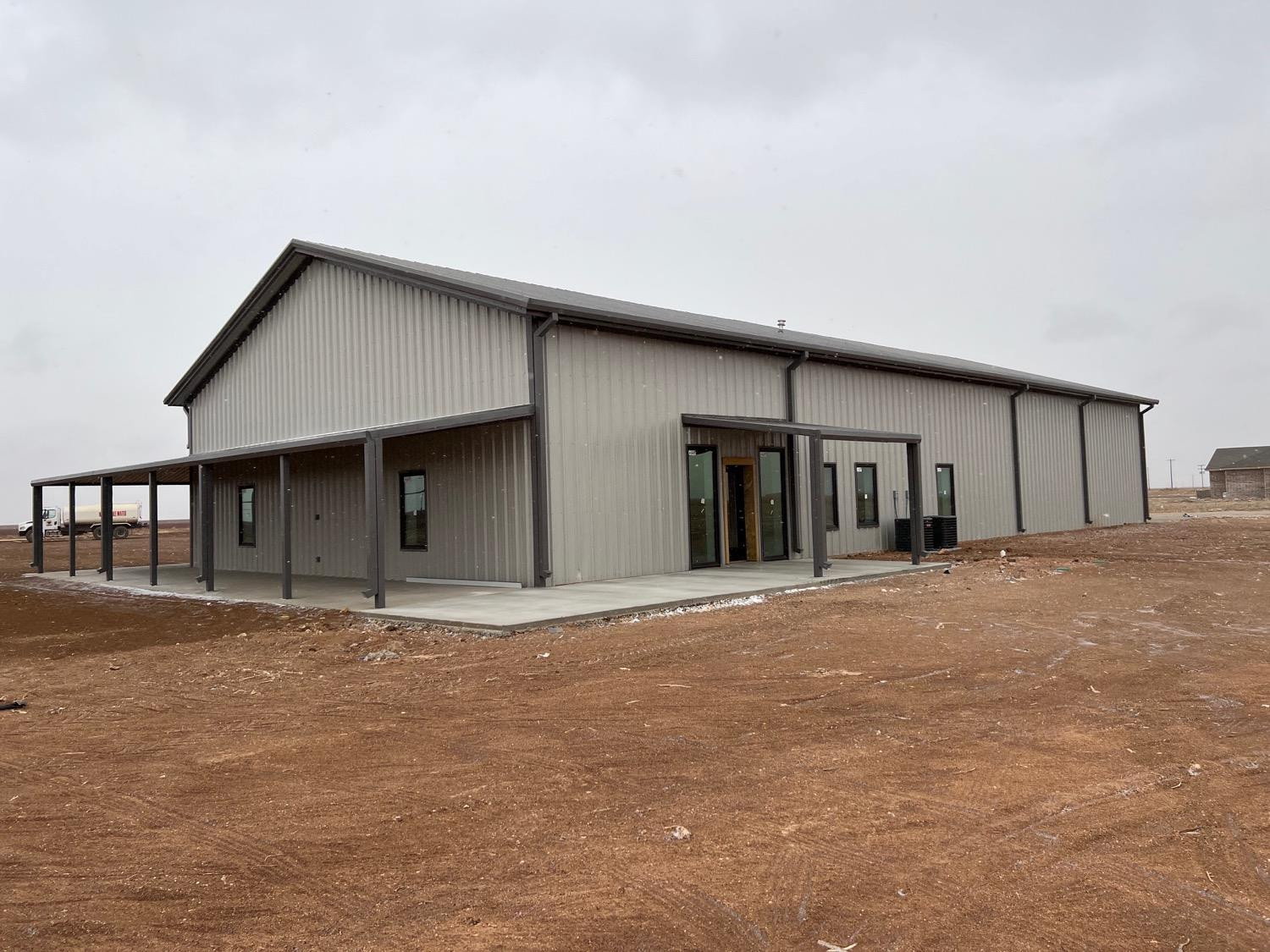 21402 County Road 2140 Lubbock, TX 79423 - Photo 2 of 23 a front view of a house with large windows
