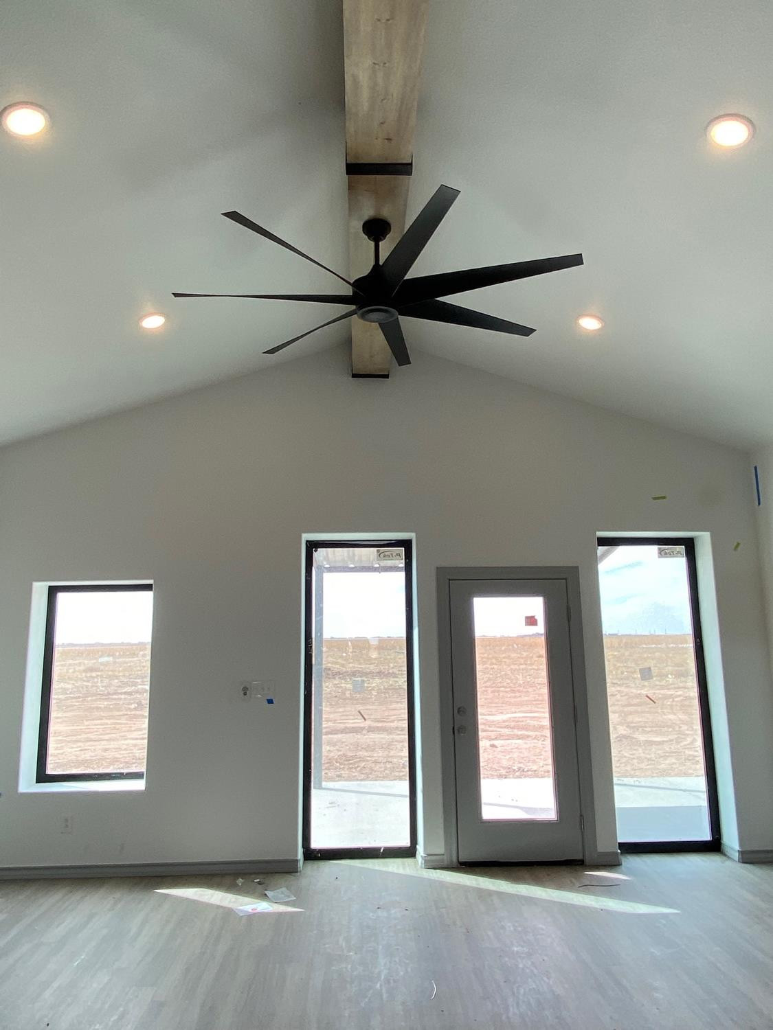21402 County Road 2140 Lubbock, TX 79423 - Photo 5 of 23 an empty room with windows and fan